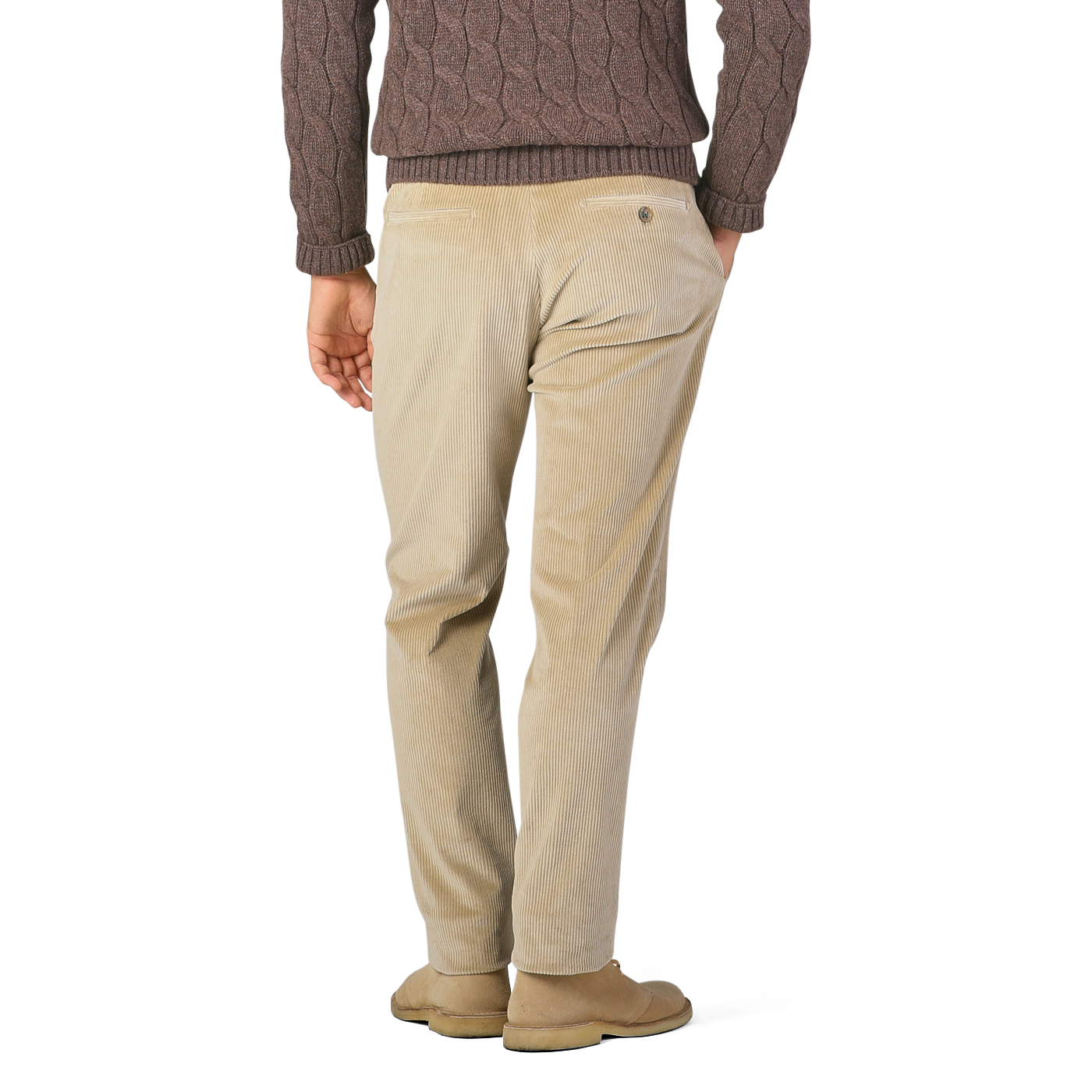 A person is standing and facing away, wearing a brown cable-knit sweater, Berwich Beige Cotton Corduroy Flat Front Trousers, and light-colored shoes.