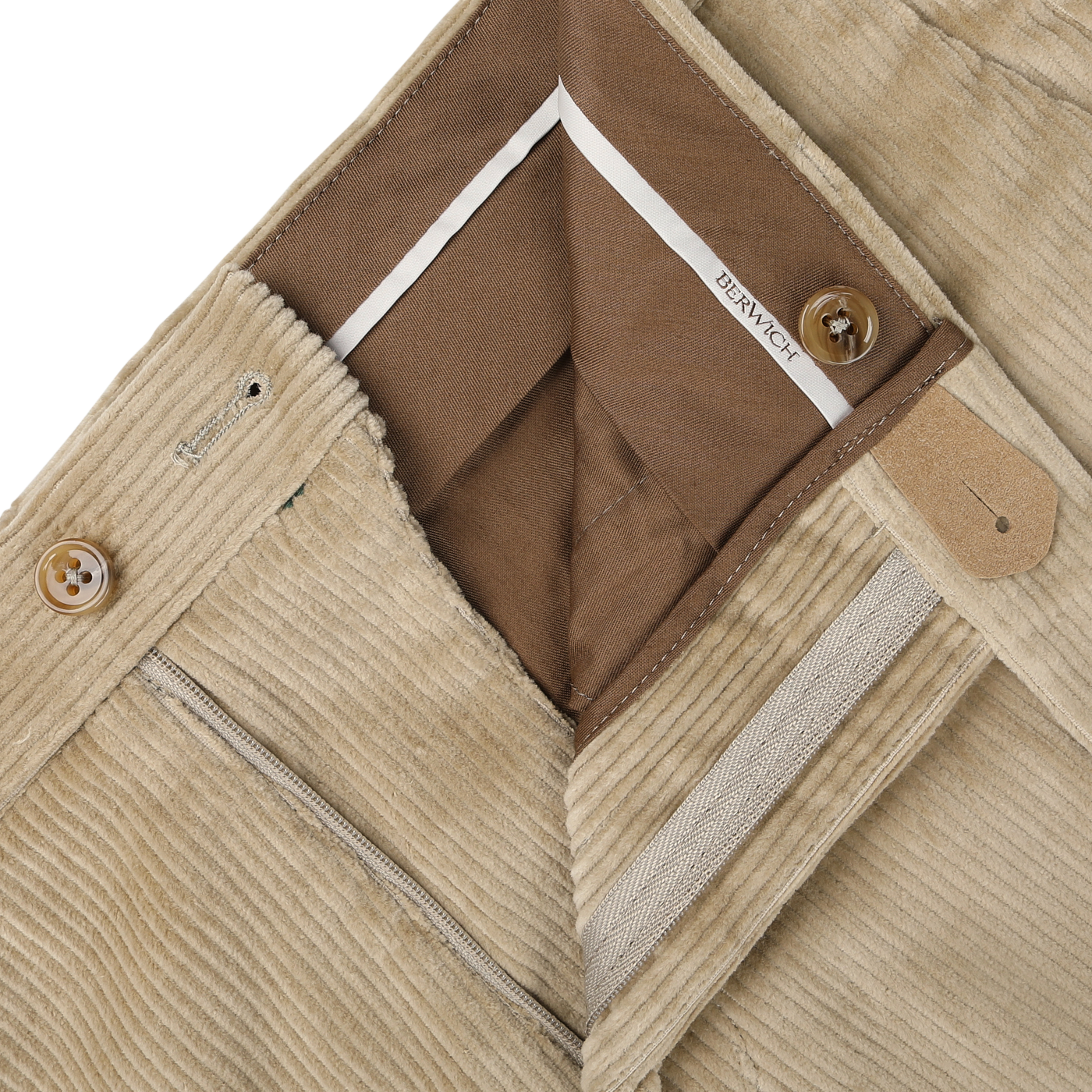 Close-up of Beige Cotton Corduroy Flat Front Trousers from Berwich, highlighting the Vulcano fit with a brown inner lining, diagonal fly with two buttons, and a branded "BERWICH" tag. Made from cotton corduroy stretch for added comfort.