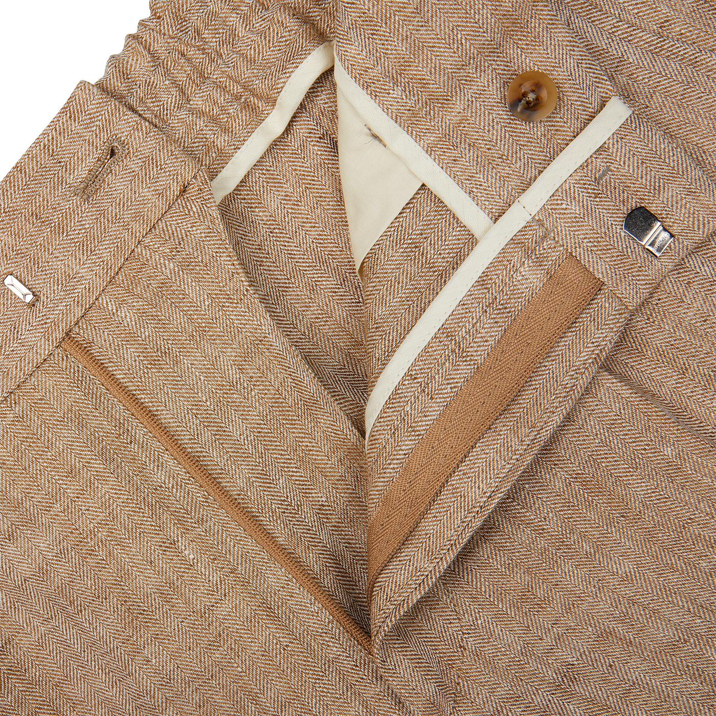 A close up of Berwich's Beige Linen Herringbone Drawstring Trousers.