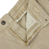 Close-up of a Berwich Beige Washed Linen Drawstring Shorts with a button, zipper, and partial collar detail.