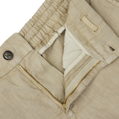 Close-up of a Berwich Beige Washed Linen Drawstring Shorts with a button, zipper, and partial collar detail.