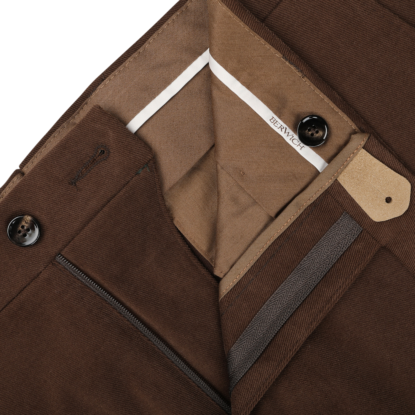 Close-up of the inner lining and button closure of Berwich Cinnamon Brown Cotton Moleskin Trousers, highlighting stitching detail and a white label with the text "BERWICH.