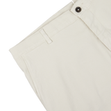 Close-up of a Berwich cream beige cotton blend Bermuda shorts detail showing button, belt loop, and stitching on white background.