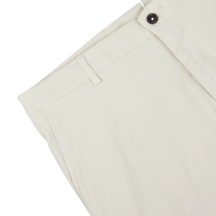 Close-up of a Berwich cream beige cotton blend Bermuda shorts detail showing button, belt loop, and stitching on white background.