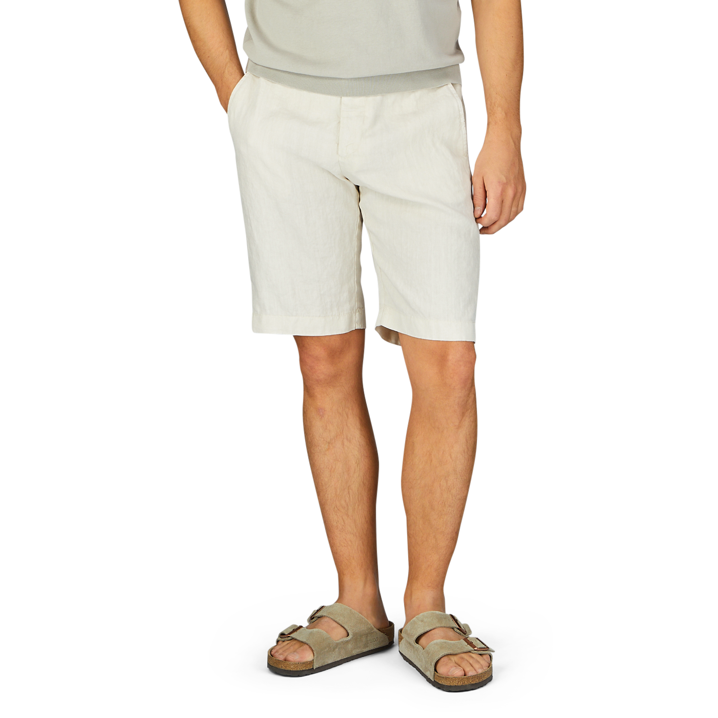 Man standing in a neutral pose wearing Berwich cream beige washed linen drawstring shorts and sandals against a gray background.