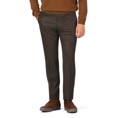 A person in a brown sweater and Berwich Dark Brown Wool Flannel Flat Front Trousers stands with hands in pockets, wearing brown shoes.