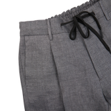 A pair of slim fit Grey Linen Herringbone Drawstring Trousers by Berwich with black ties.