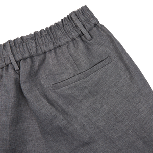 A pair of Grey Linen Herringbone Drawstring Trousers in grey by Berwich.