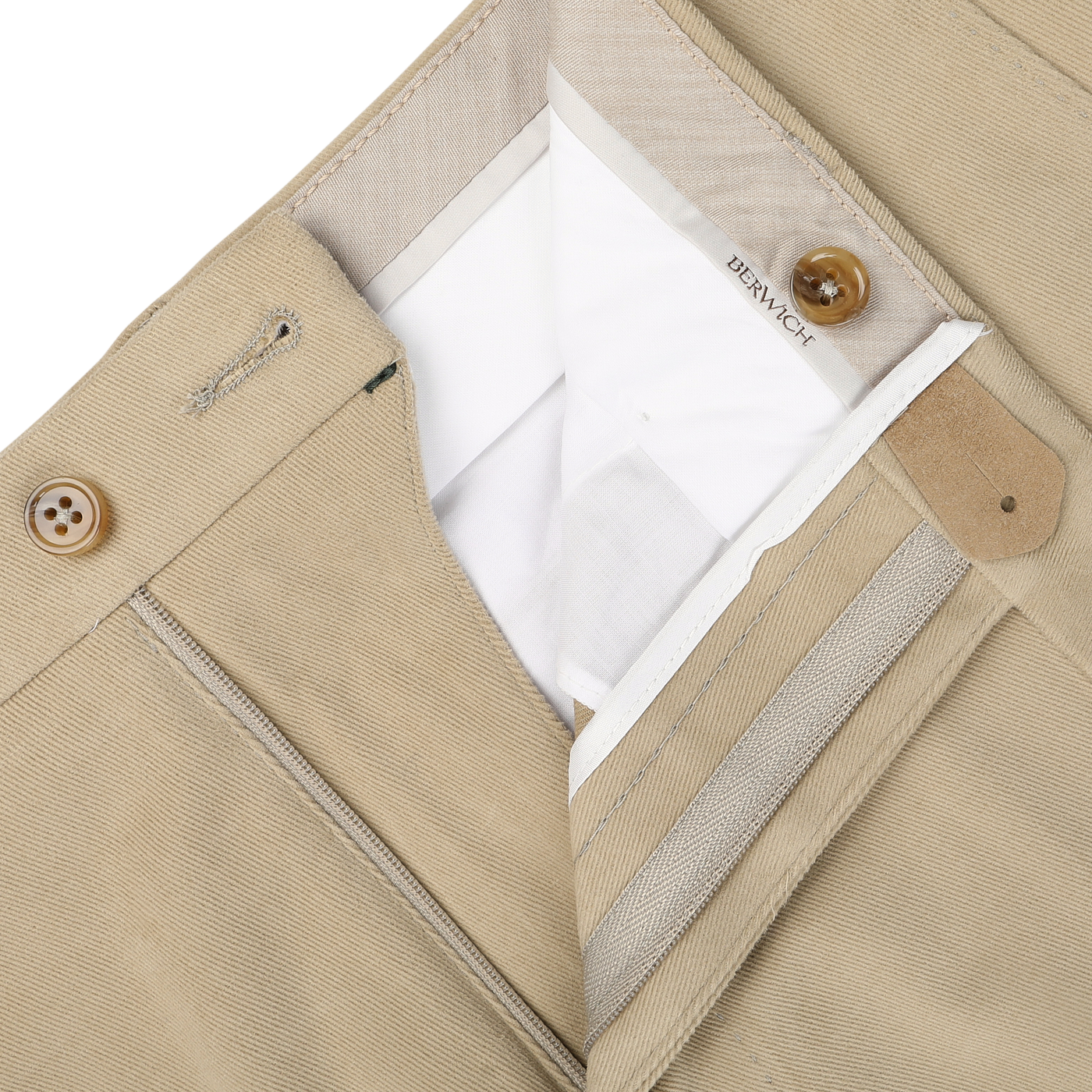 Close-up of khaki beige cotton moleskin trousers with a partially open zipper and button closure, revealing a "Berwich" label on the inner waistband. The Vulcano fit enhances the silhouette, offering comfort and style.