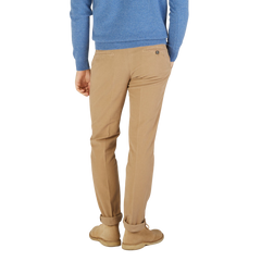 The back view of a man wearing a blue sweater and Light Beige Cotton Moleskin Chinos by Berwich.