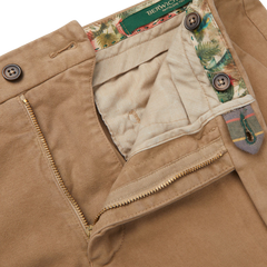 A pair of light beige cotton moleskin Berwich chinos with a pocket on the side.