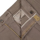 Light Brown Cotton Blend Pleated Shorts from Berwich with zipper and button details on a white background.