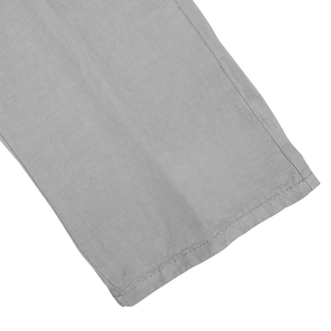 A pair of Berwich Light Grey Linen Blend Flat Front Trousers on a white surface.