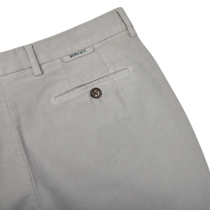A pair of Light Grey Cotton Moleskin Chinos with a button on the side, in a slim fit, by Berwich.