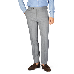 A man in a blue shirt and grey Berwich Light Grey Wool Fresco Flat Front Trousers.