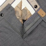 A pair of Berwich Medium Grey Wool Fresco Flat Front Trousers with a pocket, crafted from high-twist wool in a regular fit.