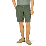 Man wearing Berwich Militare Green Washed Linen Drawstring Shorts and beige shoes.