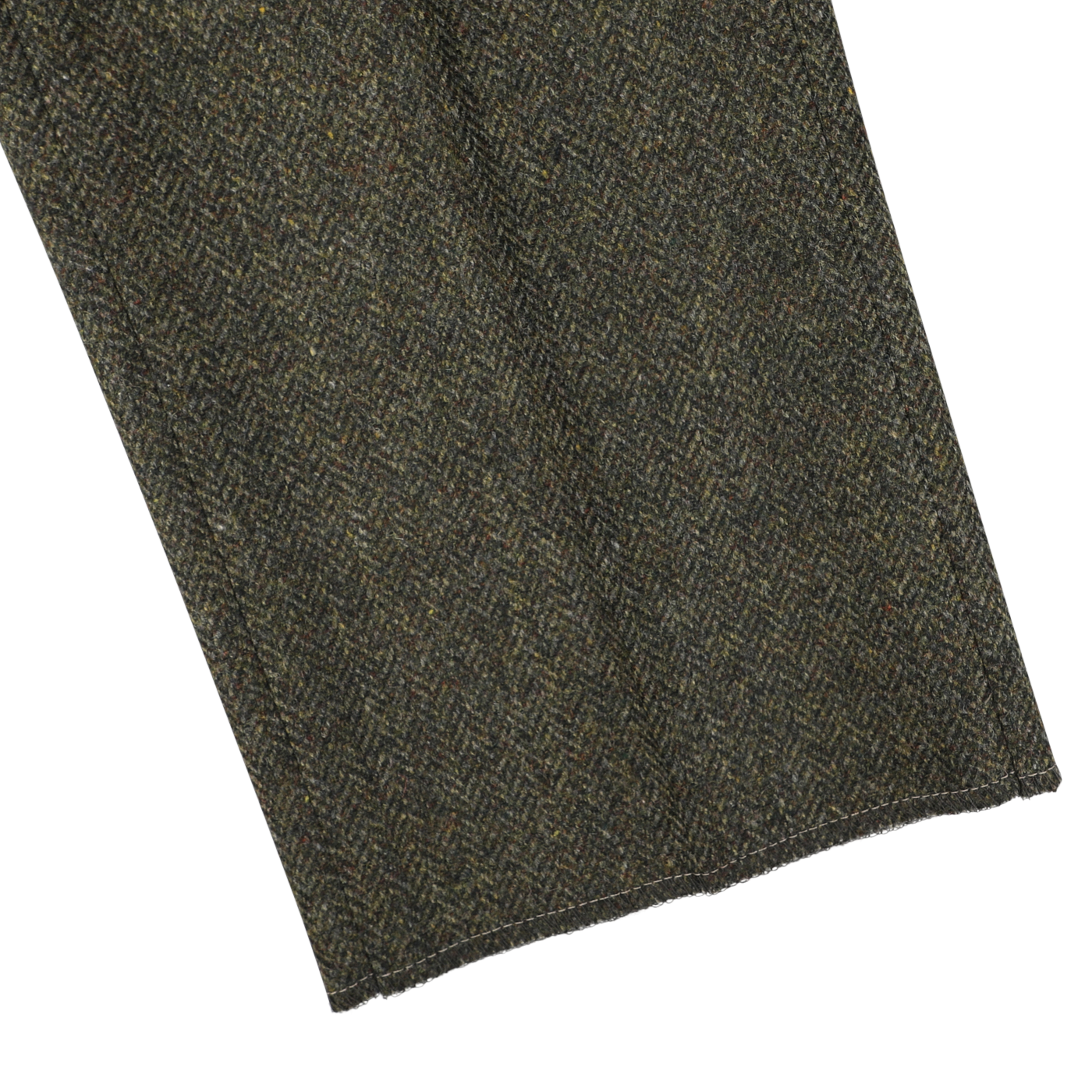 Close-up of Berwich's Moss Green Herringbone Wool Tweed Trousers, showcasing the textured tweed fabric with a herringbone pattern and visible stitching along the edges.