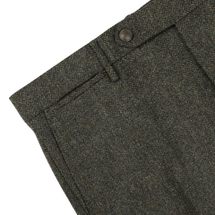 Close-up of the Berwich Moss Green Herringbone Wool Tweed Trousers, showcasing their button closure and belt loops.