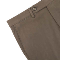 Close-up of the top part of Berwich Muted Olive Cotton Moleskin Trousers, showcasing a belt loop, button, and part of the pocket. The trousers feature a smooth cotton moleskin texture.