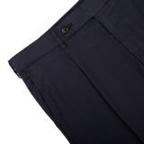 Close-up of Berwich navy blue cotton blend pleated shorts with a button closure and pleat detail.