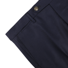 Close-up of Berwich's Navy Blue Wool Flannel Flat Front Trousers, featuring a single metal button and belt loops, partially shown on a white background.