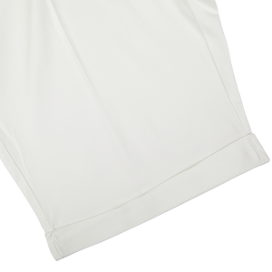 Off-White Cotton Blend Pleated Bermuda shorts by Berwich, with hem on a plain background and featuring a wider fit.