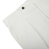 Close-up view of Berwich Bermuda shorts with a visible button closure.