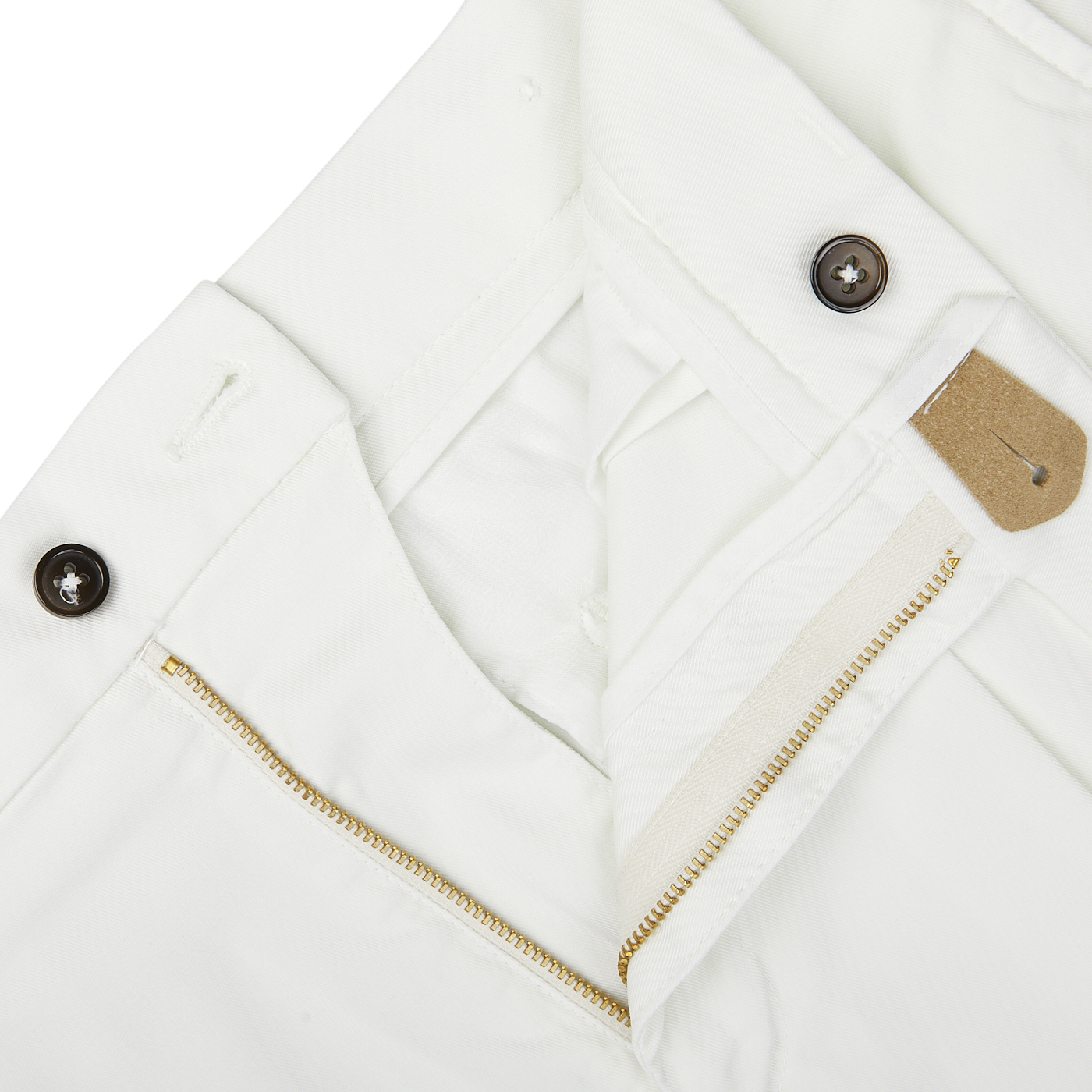 Close-up of a white Berwich jacket with a zipper, buttons, and Off-White Cotton Blend Pleated Shorts.