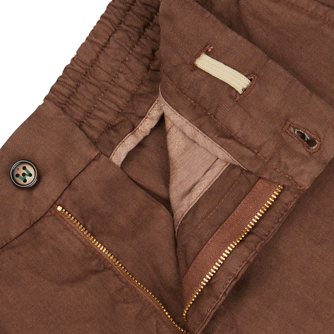 Close-up of a Berwich terra brown washed linen drawstring shorts with a zipper, button, and pocket details on a light background.