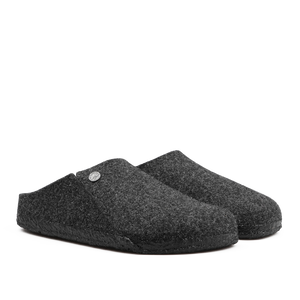 A pair of Anthracite Grey Zermatt Rivet Slippers by Birkenstock, featuring wool felt material, black rubber soles, and removable footbeds, positioned side by side.