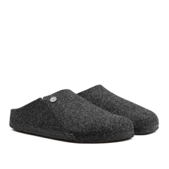 A pair of Anthracite Grey Zermatt Rivet Slippers by Birkenstock, featuring wool felt material, black rubber soles, and removable footbeds, positioned side by side.