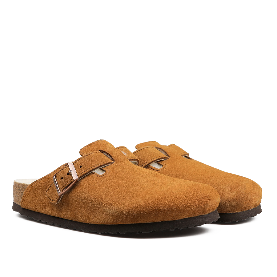 Mink brown suede shearling-lined Boston slippers featuring adjustable straps and black soles, presented from a side view, delivering the timeless comfort associated with Birkenstock.