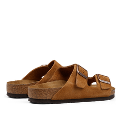 A pair of Mink Brown Suede Leather Birkenstock Arizona sandals with adjustable straps and cork footbeds.