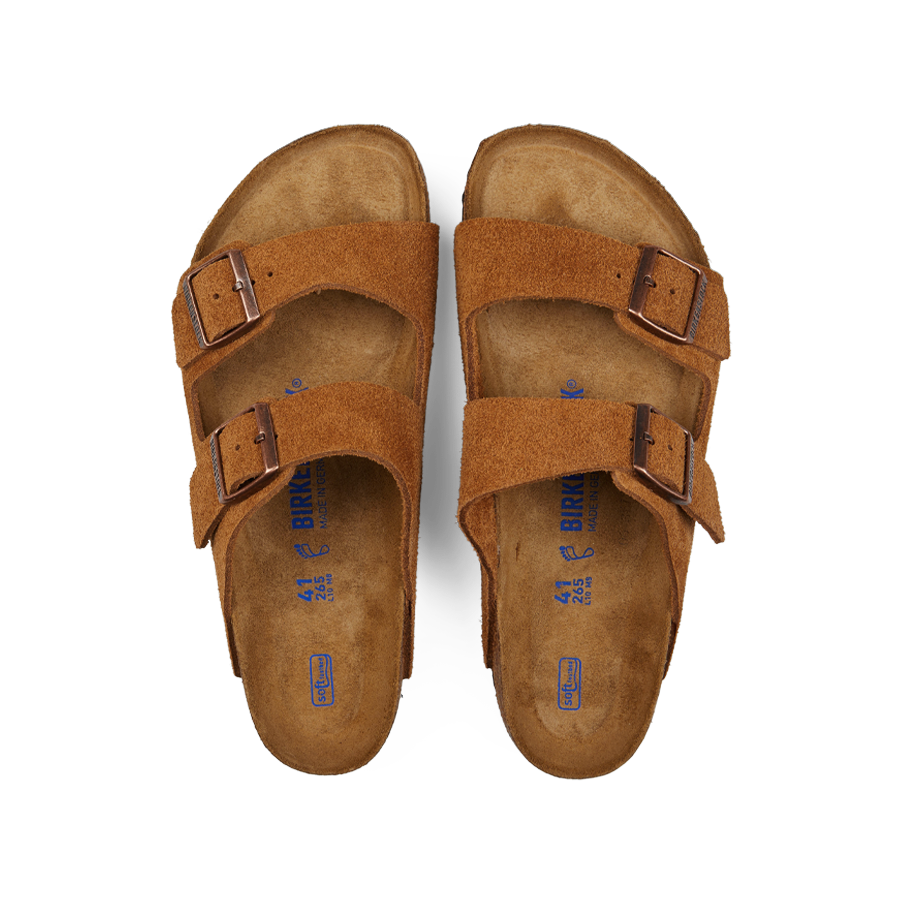 A pair of Mink Brown Suede Leather Arizona Birkenstock sandals with adjustable straps displayed on a white background.