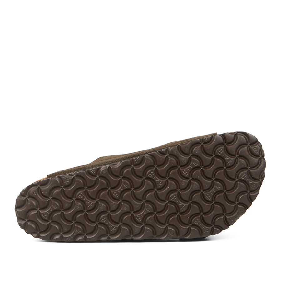 The image shows the bottom of a Birkenstock Arizona sandal with a textured rubber sole in a wavy pattern, which is likely designed for traction.