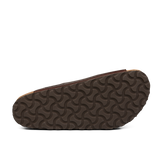 Bottom view of a Birkenstock Roast Bold Natural Leather Arizona Sandal with a dark brown sole featuring a curved, repeating pattern. The upper part of the shoe, crafted in natural leather, is partially visible in brown color.