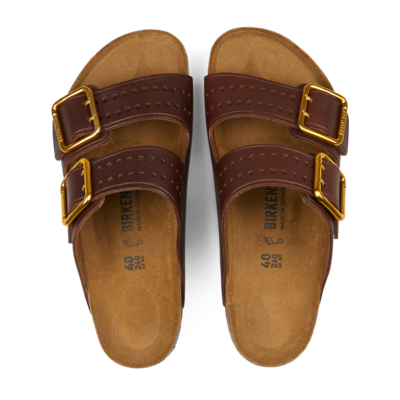 A pair of Roast Bold Natural Leather Birkenstock Arizona Sandals featuring two gold buckles on each natural leather upper strap and cork footbeds with anatomically-supported footbeds. Size details printed on the inner sole.