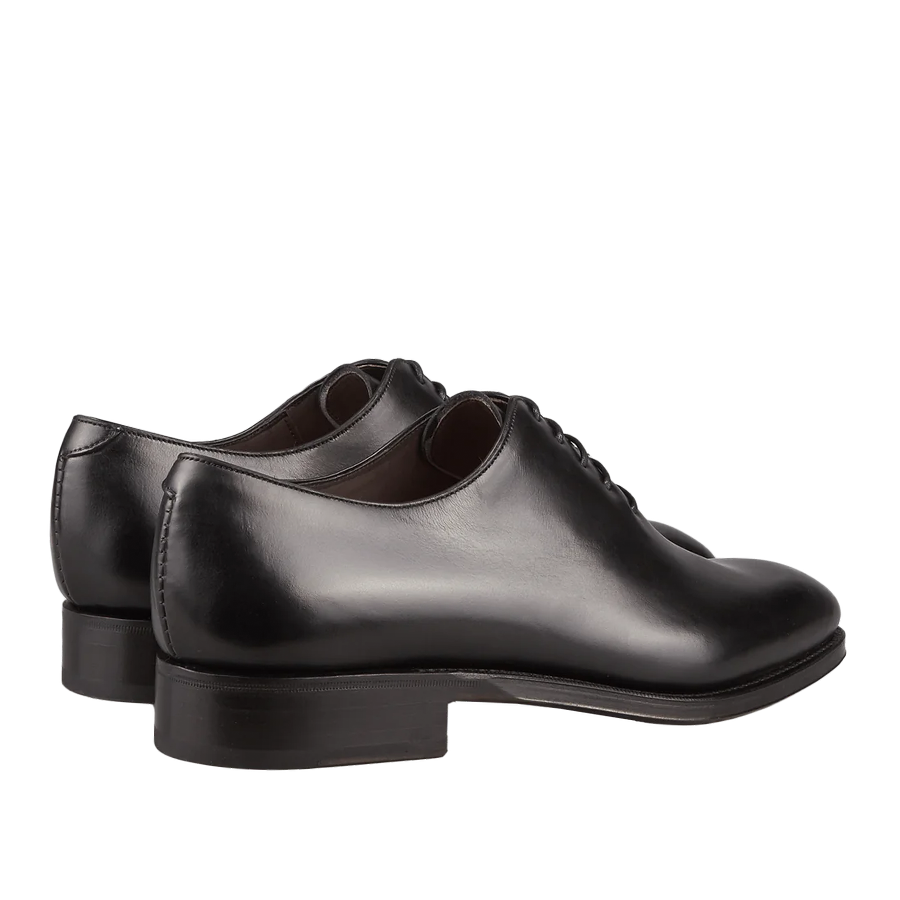A pair of black Carmina Wholecut Rain Oxford Shoes, men's dress shoes against a white background.