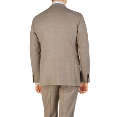 The back view of an elegant man in a Beige Grey Wool Flannel K Suit made by Boglioli.