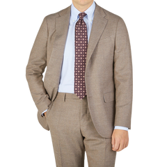 A man is posing in a seasonal Boglioli Beige Grey Wool Flannel K Suit.