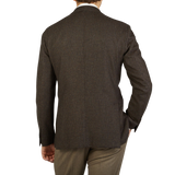 The back view of a man in a Boglioli K Jacket brown blazer, showcasing its unstructured craftsmanship and elegant made in Italy design.