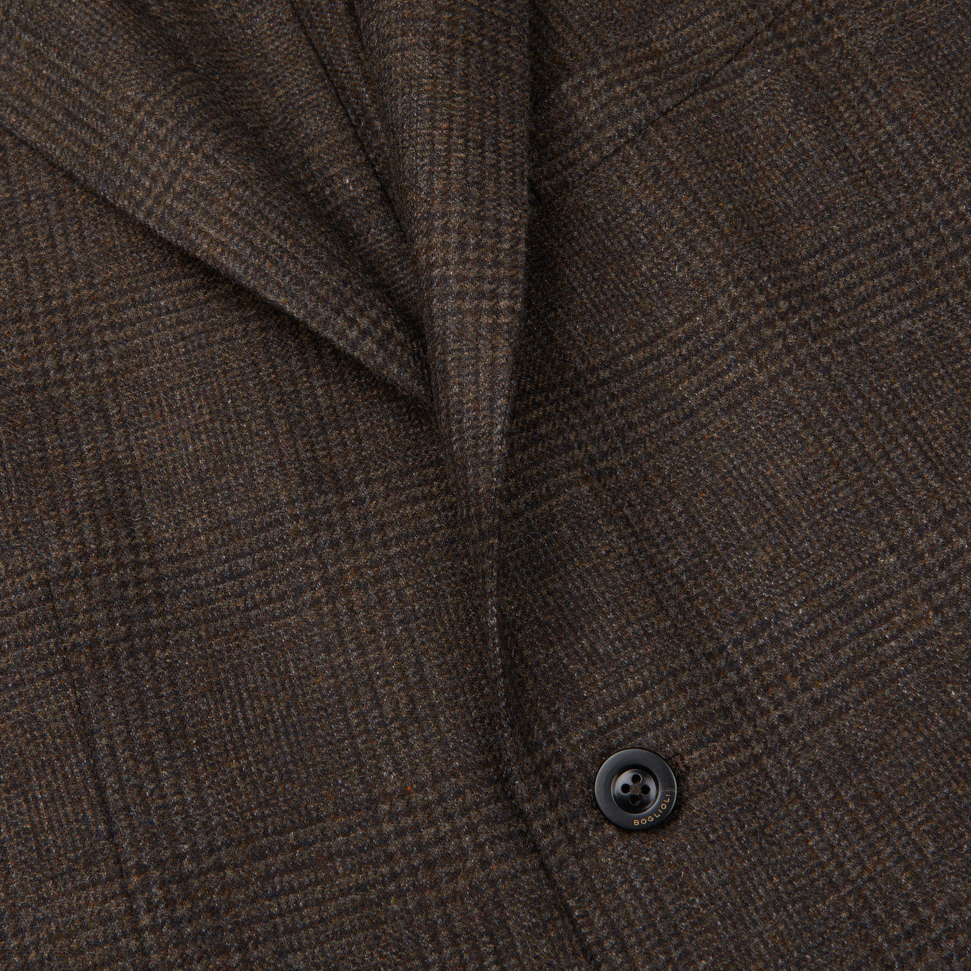 A close up image of a brown checked lambswool Boglioli K Jacket suit, exuding Italian craftsmanship.