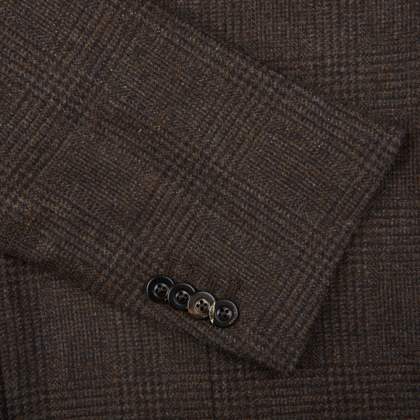 A close up of a Boglioli brown checked lambswool K Jacket suit, showcasing the exquisite craftsmanship and Italian-made quality.