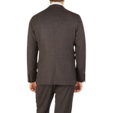 The back view of a man wearing a Boglioli Brown Melange Wool Hopsack K Suit.