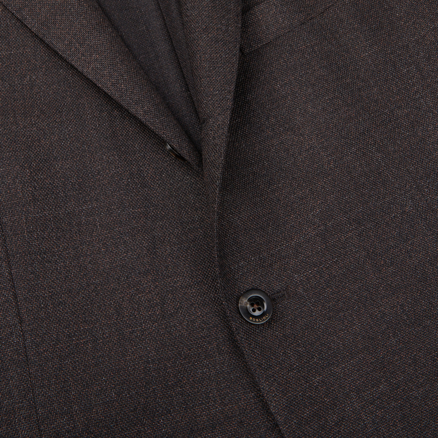 A close up image of a brown Boglioli Brown Melange Wool Hopsack K suit made from wool fabric.