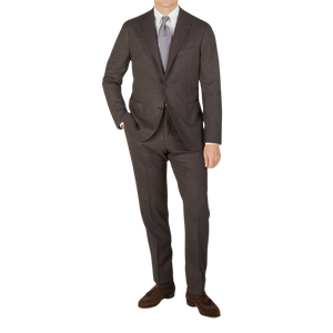 A man is posing for a picture in a Boglioli Brown Melange Wool Hopsack K Suit.