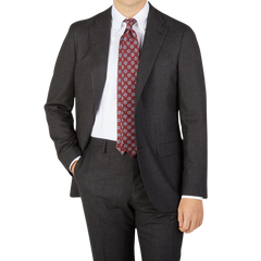 A man is posing in a Boglioli Charcoal Grey Wool Flannel K Suit and tie.