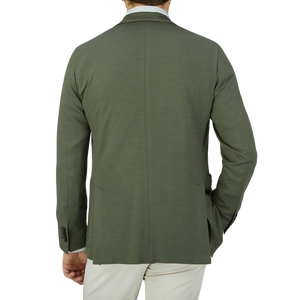 The back view of a man wearing a Dark Green Wool Jersey Boglioli Jacket.