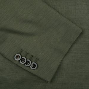 A close up of a Boglioli Dark Green Wool Jersey K Jacket with buttons, showcasing its regular fit and unstructured craftsmanship.